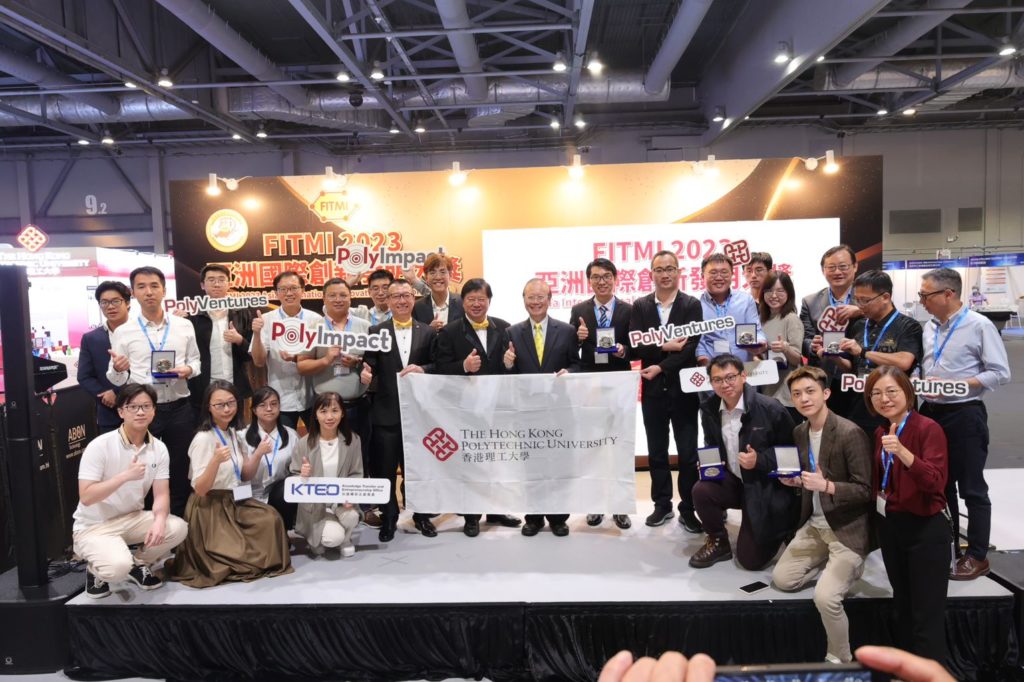 A group photo of the researchers from the Hong Kong Polytechnic University holding their medals at the exhibition.