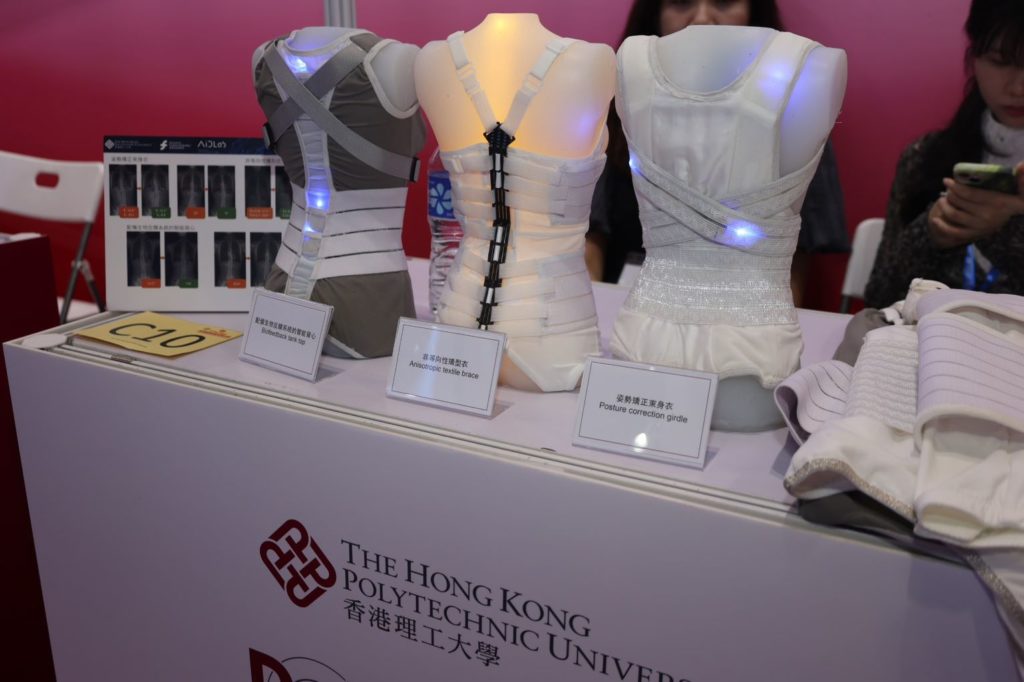 The biofeedback tank top, anisotropic textile brace, and posture correction girdle displayed at the exhibition.